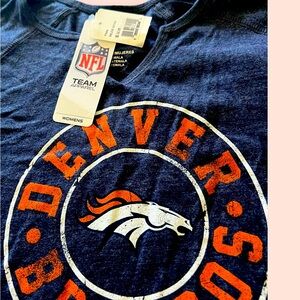 A new never worn woman’s Denver Broncos T-shirt still with tags